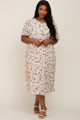 woman wearing a plus size white floral pleated midi dress with flutter sleeves and white block heel sandals