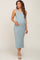 woman wearing a light blue tank maternity dress with side ruching and holding her baby bump