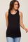 woman wearing a black maternity tank top with a fitted style and showing her baby bump while smiling.