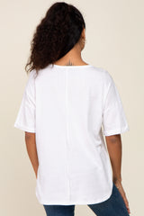 woman wearing a white oversized t-shirt with short sleeves, shown from the back