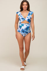 woman wearing blue floral maternity one piece swimsuit with ruffle sleeves and front cutout