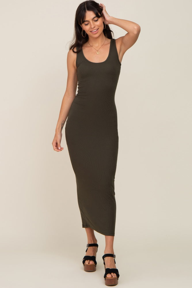 woman wearing a fitted olive green ribbed maxi dress with a scoop neckline and side slit