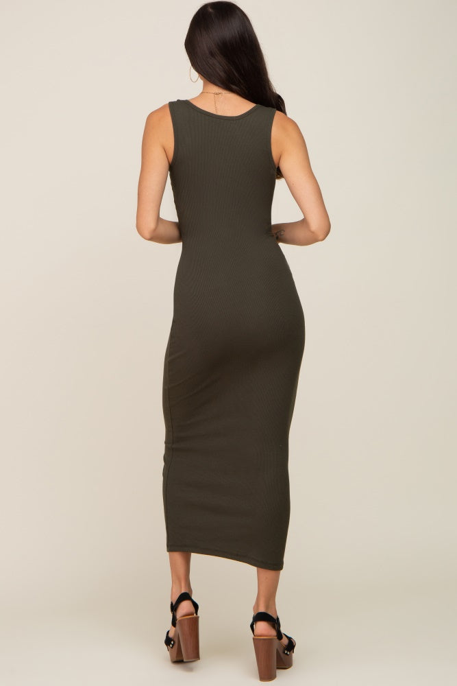 woman wearing a form-fitting olive green ribbed midi dress, showing the back view and sleek silhouette