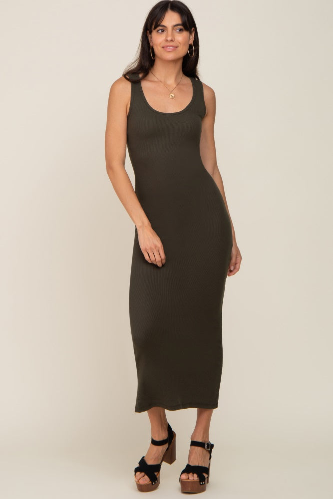 woman wearing a dark olive green ribbed maxi dress with a scoop neckline and heeled sandals