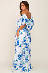 woman wearing a white off-the-shoulder maternity maxi dress with blue floral print