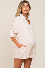 pregnant woman wearing a cream striped button-down maternity romper with pockets