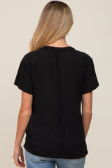 woman wearing a black short sleeve maternity t-shirt, showing the back view and casual style