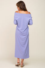 woman wearing a lavender off-the-shoulder maxi dress with long sleeves and a relaxed fit