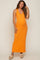 woman wearing a bright orange sleeveless maternity maxi dress and showcasing her baby bump
