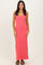 woman wearing a bright pink ribbed maxi dress with a scoop neckline and spaghetti straps