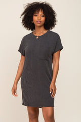 woman with afro hair wearing a charcoal grey ribbed knit t-shirt dress with a front pocket
