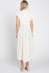 back view of woman wearing white floral midi dress with ruffle sleeves and wedge sandals