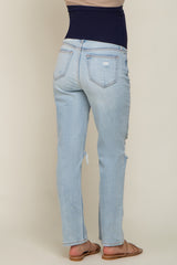 maternity wear light blue distressed jeans with a dark blue over-the-bump waistband, model seen from the back