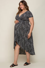 pregnant woman in black and white animal print maternity wrap dress with high-low hemline