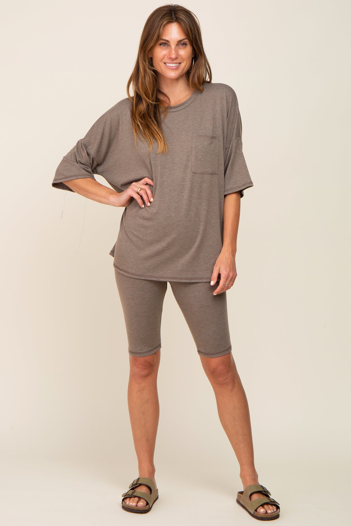 woman wearing brown oversized pocket tee and matching biker shorts lounge set with sandals