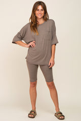 woman wearing brown oversized pocket tee and matching biker shorts lounge set with sandals