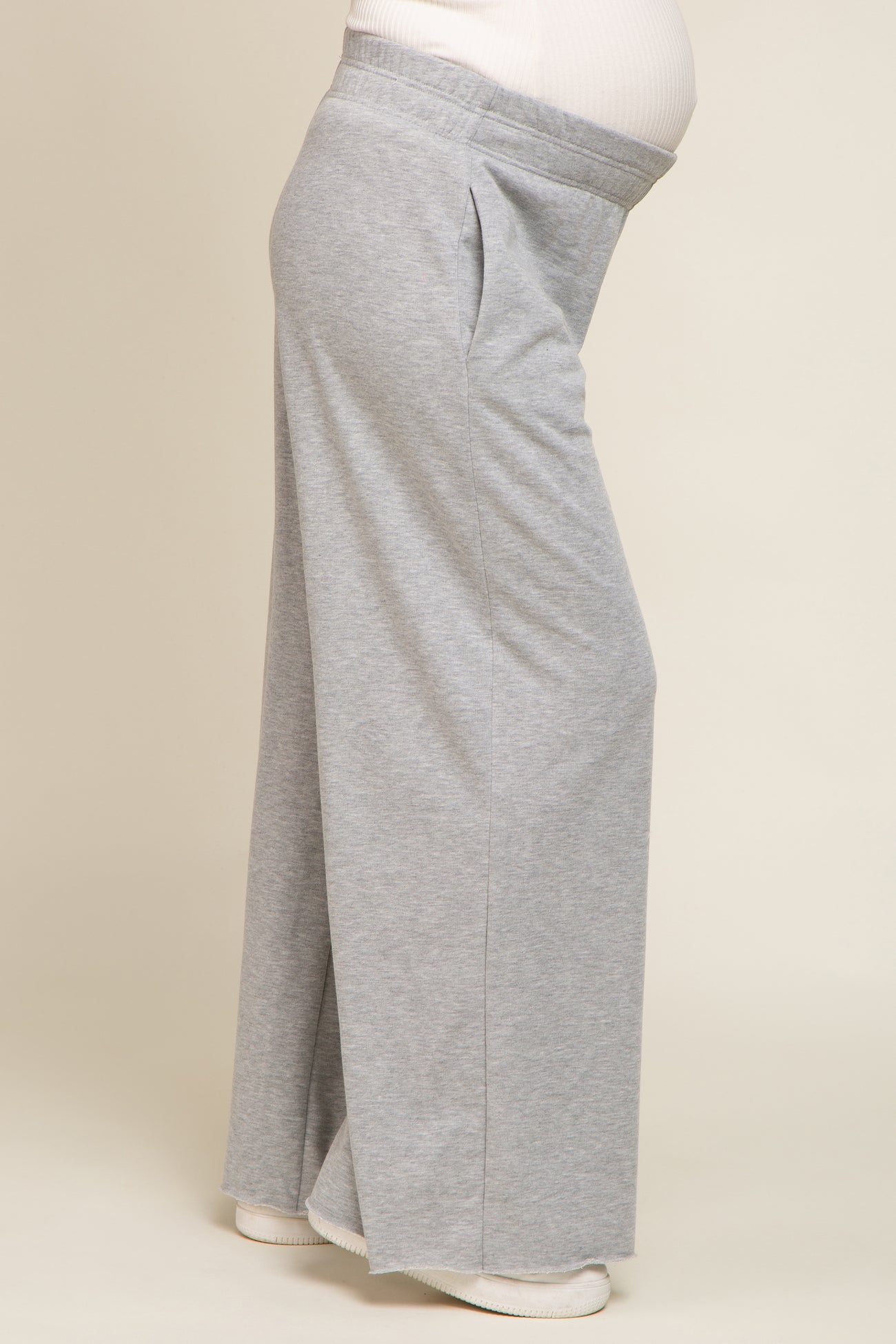 maternity wear light grey wide-leg lounge pants with side pockets and a comfortable fit over a baby bump