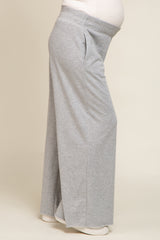 maternity wear light grey wide-leg lounge pants with side pockets and a comfortable fit over a baby bump