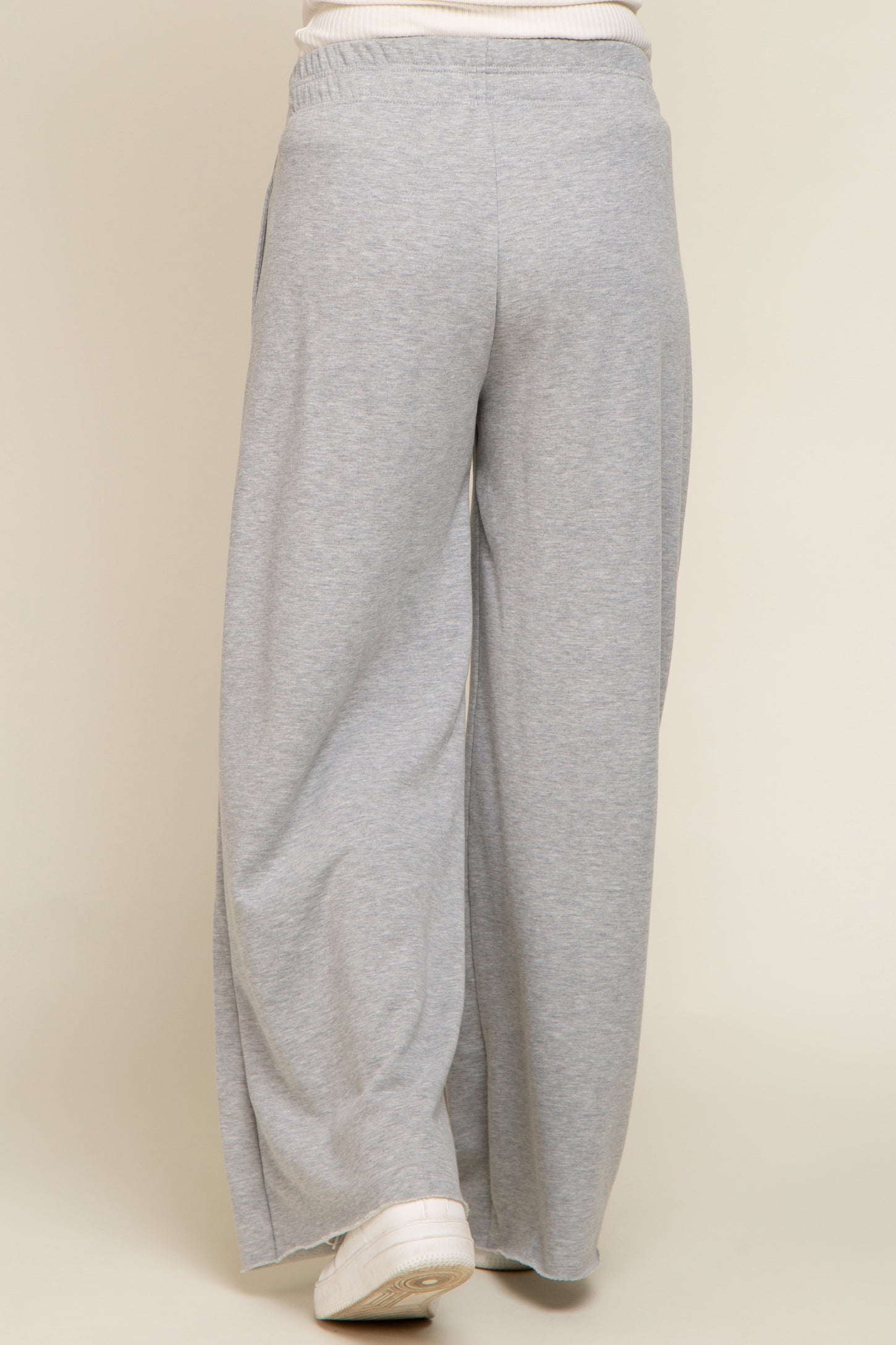 woman wearing gray wide-leg maternity sweatpants from the back