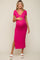 woman wearing a hot pink short sleeve maternity dress with side slits and a visible baby bump