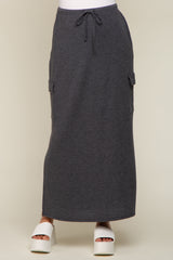 charcoal grey maxi cargo skirt with drawstring waist and side pockets paired with white platform sandals
