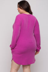 woman wearing a bright pink ribbed long sleeve maternity dress with a relaxed fit and side slits, showcasing a baby bump