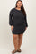 woman wearing a charcoal gray ribbed long sleeve dress with a relaxed fit and round neckline