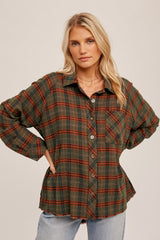 blonde woman wearing an oversized green and brown plaid flannel shirt with light wash jeans
