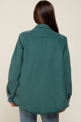 woman wearing a green corduroy maternity jacket, seen from the back
