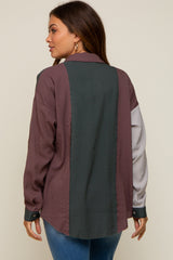 Woman wearing a colorblock corduroy button down shirt with purple, green, and white striped panels.