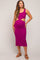 woman wearing a fuchsia cut-out maternity dress that highlights her baby bump