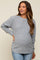 woman wearing a light gray maternity sweater with a textured knit and relaxed fit, showing her baby bump