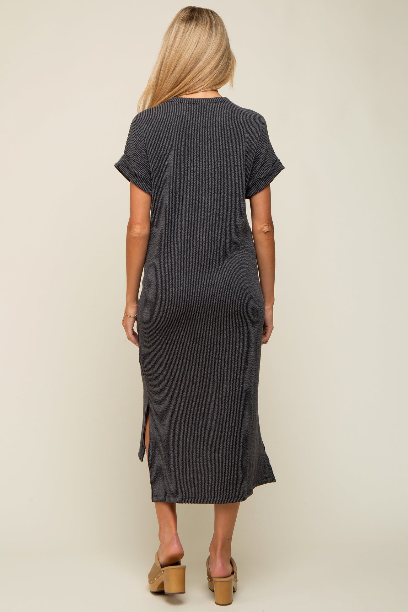 woman wearing a casual grey ribbed maternity maxi dress with side slits and short sleeves