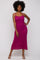 woman wearing a fuchsia ribbed knit midi dress with thin straps and a form-fitting silhouette
