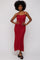 woman wearing a red ribbed knit maxi dress with thin straps and a fitted silhouette