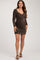 woman wearing a brown metallic long sleeve maternity dress with ruching details and a fitted silhouette