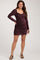 woman wearing a burgundy long sleeve ruched maternity dress with a v-neckline and visible baby bump