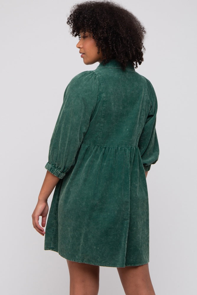 woman wearing a green denim shirt dress with a gathered waist and puffed sleeves, shown from the back