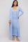 woman wearing a light blue ribbed strapless maxi dress with a matching long cardigan and white strappy heels