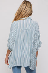 woman wearing a striped maternity shirt with a loose fit and rolled sleeves, viewed from the back