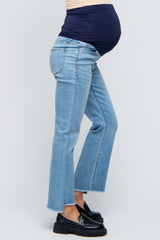 maternity wear light blue flared jeans with a navy waistband, model showing baby bump from the side