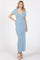woman wearing a light blue ribbed maxi dress with short sleeves and a scoop neckline