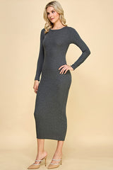 woman wearing a charcoal grey long sleeve midi dress with a fitted silhouette and mannequin heels