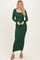 woman wearing a long sleeve emerald green ribbed maxi dress with a square neckline and a form-fitting silhouette