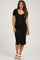 woman wearing a black ribbed maternity dress with short sleeves and button detailing, showcasing a baby bump
