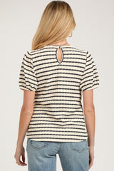 woman wearing a striped maternity top with short puff sleeves and a keyhole back detail