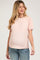 woman wearing a pink and white striped maternity top with puff sleeves, showcasing her baby bump
