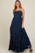 woman wearing a navy blue strapless maternity maxi dress with tiered ruffles and lace detail