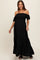 woman wearing a black off-the-shoulder maternity dress with ruffle sleeves and tiered skirt, showing baby bump