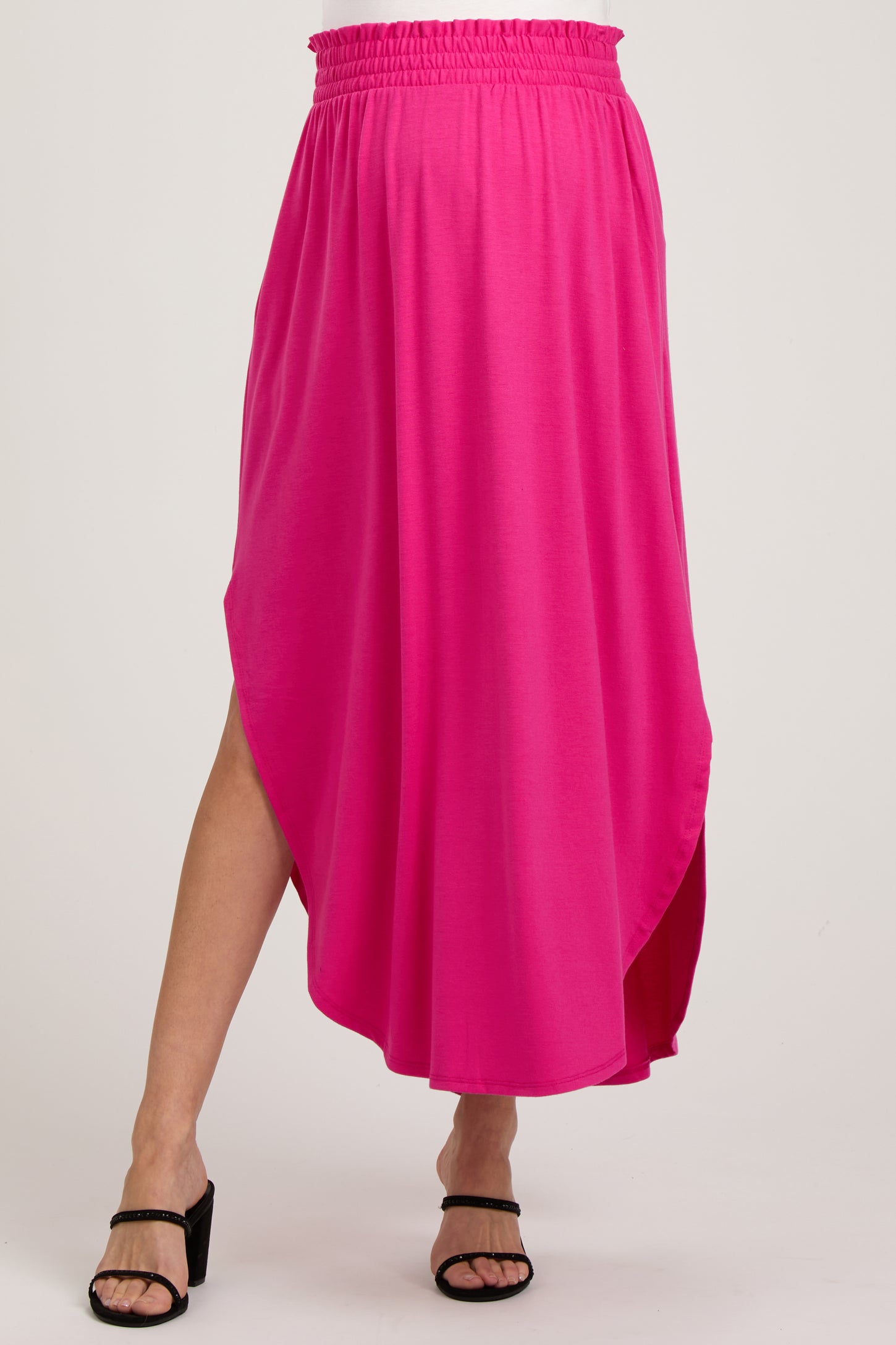 maternity wear bright pink maxi skirt with side slits and an elastic waistband
